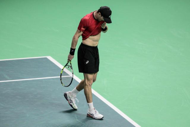 Belgium's Raphael Collignon reacts as he plays against France's Corentin Moutet during their Davis Cup men's singles quarter finals tennis match, at the Super Tennis Arena, in Bologna, northen Italy, on November 18, 2025. (Photo by Tiziana FABI / AFP)