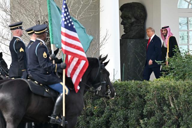 US President Donald Trump and Crown Prince and Prime Minister of the Kingdom of Saudi Arabia Mohammed bin Salman walk down the Colonnade on the way to the Oval Office of the White House in Washington, DC on November 18, 2025. Saudi Crown Prince Mohammed bin Salman arrived at the White House to fanfare and a jet flyover Tuesday, in his first visit to the United States since the 2018 murder of journalist Jamal Khashoggi. (Photo by SAUL LOEB / AFP)