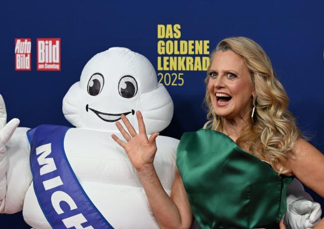 TV host Barbara Schoeneberger poses on the red carpet upon arrival for the "Goldenes Lenkrad" (Golden Steering Wheel) awards on November 18, 2025 in Berlin. (Photo by RALF HIRSCHBERGER / AFP)