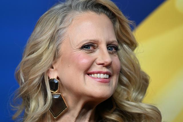 TV host Barbara Schoeneberger poses on the red carpet upon arrival for the "Goldenes Lenkrad" (Golden Steering Wheel) awards on November 18, 2025 in Berlin. (Photo by RALF HIRSCHBERGER / AFP)
