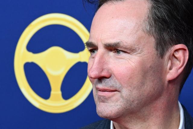 CEO of German carmaker Volkswagen (VW) Thomas Schaefer poses on the red carpet upon arrival for the "Goldenes Lenkrad" (Golden Steering Wheel) awards on November 18, 2025 in Berlin. (Photo by RALF HIRSCHBERGER / AFP)
