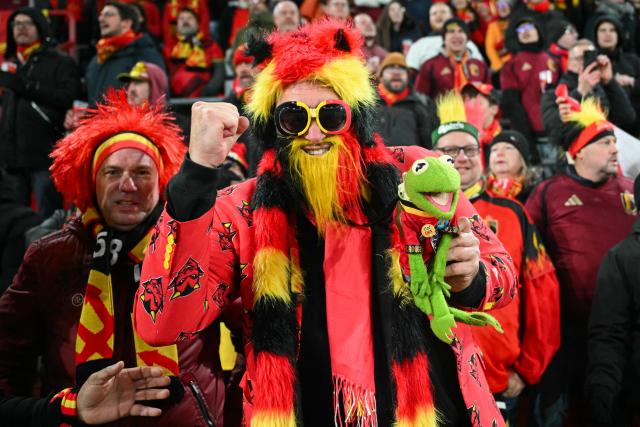 Belgian supporters cheer ahead of the FIFA World Cup 2026 Group J European qualification football match between Belgium and Liechtenstein at the Maurice-Dufrasne stadium, in Liege, on November 18, 2025. (Photo by NICOLAS TUCAT / AFP)