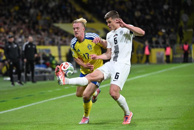 Sweden's forward #17 Isac Lidberg and Slovenia's defender #06 Jaka Bijol vie for the ball during the FIFA World Cup 2026 European qualification Group B football match between Sweden and Slovenia, in Solna on November 18, 2025. (Photo by Jonathan Nackstrand / AFP)