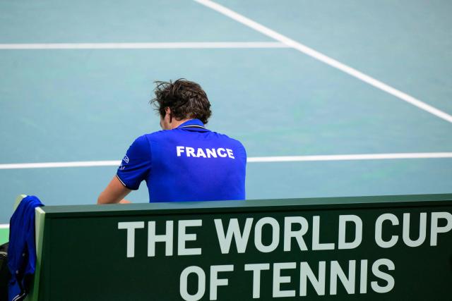 France's Arthur Rinderknech reacts after he played against Belgium's Zizou Bergs during their Davis Cup men's singles quarter finals tennis match, at the Super Tennis Arena, in Bologna, northen Italy, on November 18, 2025. Belgium eliminates France in the quarterfinals and qualified for the semifinals. (Photo by Tiziana FABI / AFP)