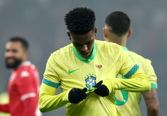 Brazil's forward #20 Estevao celebrates after scoring Brazil's first goal from the penalty spot during the International friendly football match between Brazil and Tunisia at Stade Pierre-Mauroy, in Villeneuve-d'Ascq, northern France, on November 18, 2025. (Photo by FRANCK FIFE / AFP)