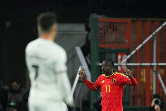 Belgium's forward #11 Jeremy Doku celebrates after scoring his team second goal during the FIFA World Cup 2026 Group J European qualification football match between Belgium and Liechtenstein at the Maurice-Dufrasne stadium, in Liege, on November 18, 2025. (Photo by NICOLAS TUCAT / AFP)