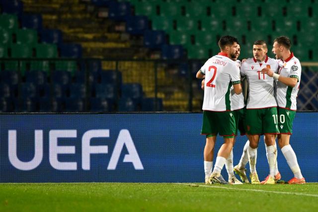 Bulgaria's midfielder #14 Filip Krastev 92nd L) celebrates with teammates after scoring his team's second goal during the FIFA World Cup 2026 European qualification football match between Bulgaria and Georgia at the Vassil levski stadium, in Sofia, on November 18, 2025. (Photo by Nikolay DOYCHINOV / AFP)