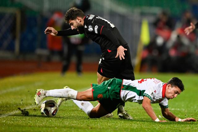 Georgia's forward #10 Zuriko Davitashvili (R) fights for the ball with Bulgaria's midfielder #14 Filip Krastev during theFIFA World Cup 2026 European qualification football match between Bulgaria and Georgia at the Vassil levski stadium, in Sofia, on November 18, 2025. (Photo by Nikolay DOYCHINOV / AFP)