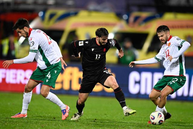 Bulgaria's midfielder #22 Kristiyan Stoyanov (R) fights for the ball with Georgia's midfielder #11 Saba Lobzhanidze (C) during the FIFA World Cup 2026 European qualification football match between Bulgaria and Georgia at the Vassil levski stadium, in Sofia, on November 18, 2025. (Photo by Nikolay DOYCHINOV / AFP)