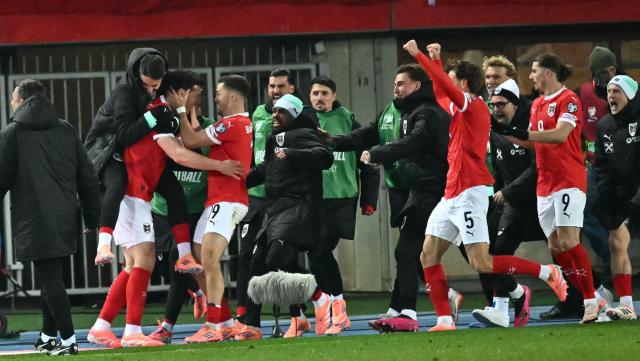 Austria's forward #11 Michael Gregoritsch celebrates with teammates scoring the equalizer during the FIFA World Cup 2026 European qualification Group H football match between Austria and Bosnia and Herzegovina, in Vienna on November 18, 2025. (Photo by Joe Klamar / AFP)