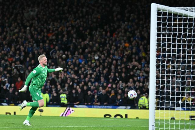 Denmark's goalkeeper #01 Kasper Schmeichel is beaten by a long-range shot from Scotland's midfielder #23 Kenny McLean during the FIFA World Cup 2026 European qualification football match between Scotland and Denmark at Hampden Park in Glasgow on November 18, 2025.  (Photo by ANDY BUCHANAN / AFP)