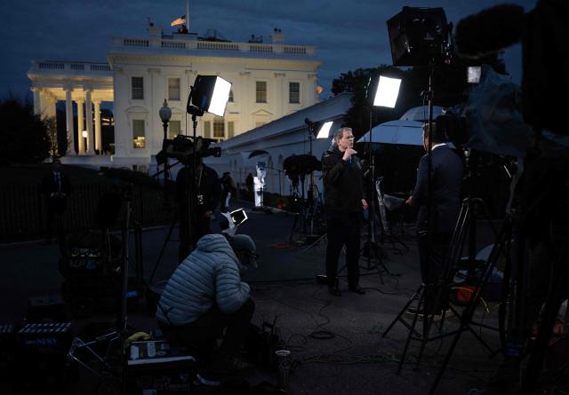 US Secretary of the Treasury Scott Bessent (C) gives an interview to FOX News' anchor Bret Baier outside the West Wing of the White House in Washington, DC on November 18, 2025. (Photo by ANDREW CABALLERO-REYNOLDS / AFP)
