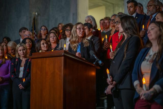 Annie Farmer, victim of convicted sex offender Jeffrey Epstein, speaks from the podium during a candlelight vigil to honor survivors of his crimes in Washington, DC on November 18, 2025. US lawmakers voted overwhelmingly on November 18 for releasing government files on convicted sex offender Jeffrey Epstein, after President Donald Trump dropped his opposition to opening the books on a scandal that has roiled politics, law enforcement and the country's elite. (Photo by DANIEL HEUER / AFP)
