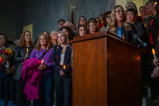 Annie Farmer, victim of convicted sex offender Jeffrey Epstein, speaks from the podium during a candlelight vigil to honor survivors of his crimes in Washington, DC on November 18, 2025. US lawmakers voted overwhelmingly on November 18 for releasing government files on convicted sex offender Jeffrey Epstein, after President Donald Trump dropped his opposition to opening the books on a scandal that has roiled politics, law enforcement and the country's elite. (Photo by DANIEL HEUER / AFP)