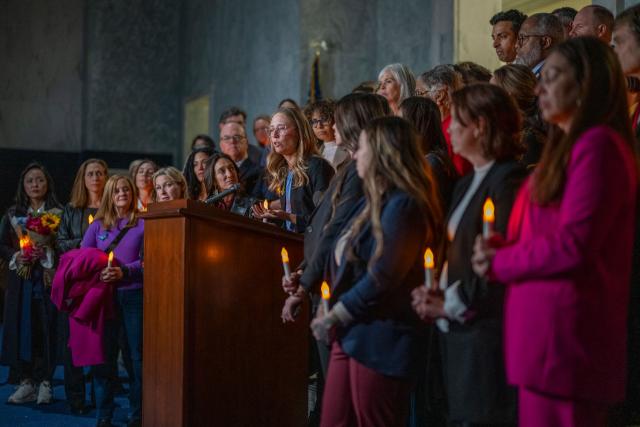 Annie Farmer, victim of convicted sex offender Jeffrey Epstein, speaks from the podium during a candlelight vigil to honor survivors of his crimes in Washington, DC on November 18, 2025. US lawmakers voted overwhelmingly on November 18 for releasing government files on convicted sex offender Jeffrey Epstein, after President Donald Trump dropped his opposition to opening the books on a scandal that has roiled politics, law enforcement and the country's elite. (Photo by DANIEL HEUER / AFP)