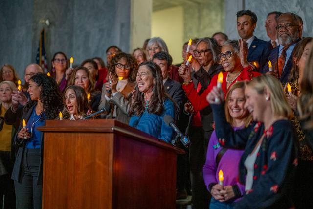 US congresswoman Teresa Leger Fernandez (C), Democrat of New Mexico, announces to attendees of a candlelight vigil to honor the victims of convicted sex offender Jeffrey Epstein, that the US Senate passed the "Epstein Files Transparency Act" in Washington, DC on November 18, 2025. The US Senate on Tuesday approved a House-passed bill ordering the release of federal files on Jeffrey Epstein, the disgraced financier whose extensive alleged sex trafficking network fueled one of the country's most incendiary scandals. (Photo by DANIEL HEUER / AFP)