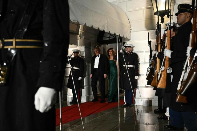 US President Donald Trump and First Lady Melania Trump step out to welcome the Crown Prince and Prime Minister of the Kingdom of Saudi Arabia Mohammed bin Salman prior to a state dinner at the White House in Washington, DC on November 18, 2025. (Photo by Brendan SMIALOWSKI / AFP)
