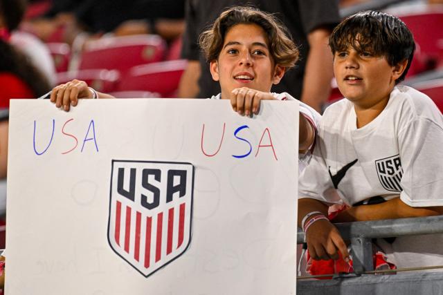 USA fans cheer ahead of the international friendly football match between USA and Uruguay at the Raymond James Stadium in Tampa, Florida on November 18, 2025. (Photo by Miguel J. Rodriguez Carrillo / AFP)