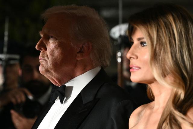 US President Donald Trump and First Lady Melania Trump wait for the arrival of the Crown Prince and Prime Minister of the Kingdom of Saudi Arabia Mohammed bin Salman prior to a state dinner at the White House in Washington, DC on November 18, 2025. (Photo by Brendan SMIALOWSKI / AFP)