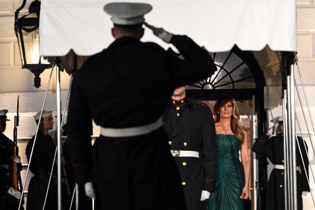 US First Lady Melania Trump, accompanied by President Donald Trump, waits for the arrival of the Crown Prince and Prime Minister of the Kingdom of Saudi Arabia Mohammed bin Salman prior to a state dinner at the White House in Washington, DC on November 18, 2025. (Photo by ANDREW CABALLERO-REYNOLDS / AFP)