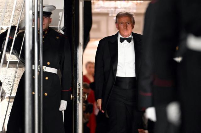 US President Donald Trump steps out to welcome the Crown Prince and Prime Minister of the Kingdom of Saudi Arabia Mohammed bin Salman prior to a state dinner at the White House in Washington, DC on November 18, 2025. (Photo by ANDREW CABALLERO-REYNOLDS / AFP)