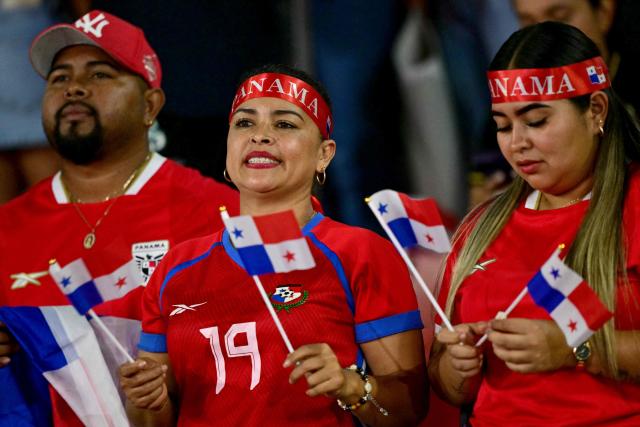 Panama fans cheer before the 2026 FIFA World Cup Concacaf qualifier football match between Panama and El Salvador at the Rommel Fernandez Stadium in Panama City on November 18, 2025. (Photo by MARTIN BERNETTI / AFP)
