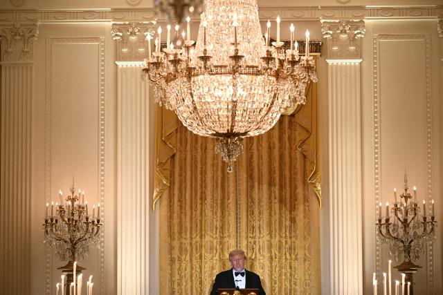 US President Donald Trump speaks during an official dinner with Crown Prince and Prime Minister of the Kingdom of Saudi Arabia Mohammed bin Salman in the East Room of the White House in Washington, DC on November 18, 2025. (Photo by Brendan SMIALOWSKI / AFP)