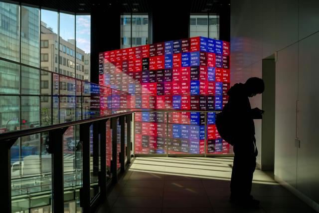 An electronic quotation board displays the Nikkei 225 stock prices on the Tokyo Stock Exchange during a morning session in Tokyo on November 19, 2025. (Photo by Kazuhiro NOGI / AFP)