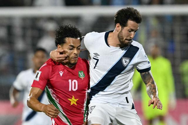Suriname's midfielder #10 Denzel Jubitana and Guatemala's defender #07 Aaron Herrera fight for the ball during the 2026 FIFA World Cup Concacaf qualifier football match between Guatemala and Suriname at the Manuel Felipe Carrera stadium in Guatemala City on November 18, 2025. (Photo by JOHAN ORDONEZ / AFP)