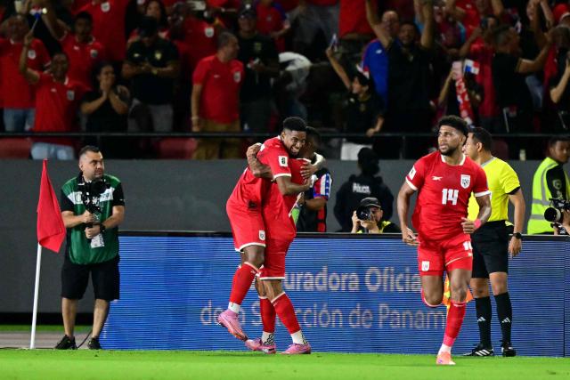 Panama's defender #02 Cesar Blackman celebrates after scoring wirth teammate defender #15 Eric Davis during the 2026 FIFA World Cup Concacaf qualifier football match between Panama and El Salvador at the Rommel Fernandez Stadium in Panama City on November 18, 2025. (Photo by MARTIN BERNETTI / AFP)