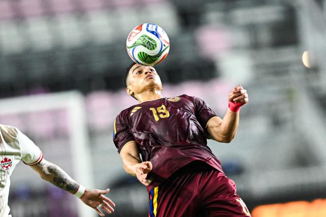 Venezuela's forward #19 Kevin Kelsy heads the ball during the international friendly football match between Canada and Venezuela at Chase Stadium in Fort Lauderdale, Florida, on November 18, 2025. (Photo by CHANDAN KHANNA / AFP)