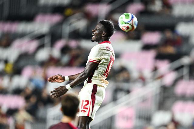 Canada's forward #12 Tanitoluwa Oluwaseyi jumps for the ball during the international friendly football match between Canada and Venezuela at Chase Stadium in Fort Lauderdale, Florida, on November 18, 2025. (Photo by CHANDAN KHANNA / AFP)