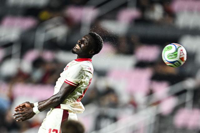 Canada's forward #12 Tanitoluwa Oluwaseyi jumps for the ball during the international friendly football match between Canada and Venezuela at Chase Stadium in Fort Lauderdale, Florida, on November 18, 2025. (Photo by CHANDAN KHANNA / AFP)