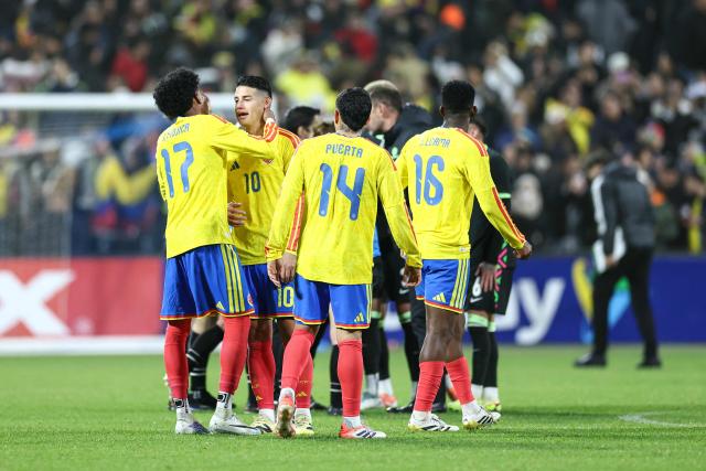 Colombia’s players celebrate after winning the international friendly football match against Australia at Citifield stadium in the Queens borough of New York City on November 18, 2025. (Photo by CHARLY TRIBALLEAU / AFP)