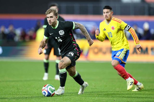 Australia’s midfielder #14 Riley McGree fights for the ball with Colombia’s Midfielder #10 James Rodriguez during the international friendly football match between Colombia and Australia at Citifield stadium in the Queens borough of New York City on November 18, 2025. (Photo by CHARLY TRIBALLEAU / AFP)