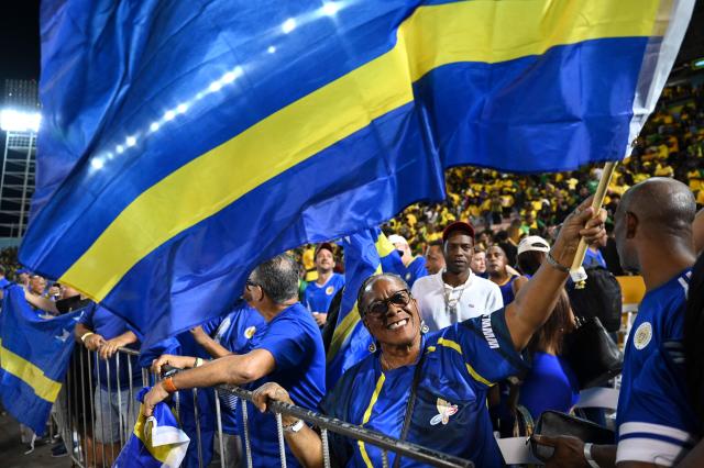 Curaçao fans celebrate World Cup 2026 qualification after a 0-0 draw with Jamaica at the National Stadium in Kingston, Jamaica on November 18, 2025. The tiny Caribbean nation of Curacao became the smallest country ever to qualify for the World Cup on November 18 as Haiti booked their return to the tournament for the first time in 52 years along with Panama.
A nerve-shredding finale to the CONCACAF qualifying campaign saw Curacao -- with a population of just 156,000 -- squeeze into next year's finals in the United States, Canada and Mexico with a 0-0 draw against Jamaica in Kingston. (Photo by Ricardo MAKYN / AFP)