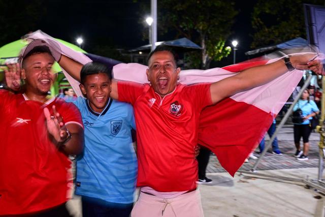 Panamanians celebrate after Panama qualified for the 2026 FIFA World Cup in Panama City on November 18, 2025. (Photo by MARTIN BERNETTI / AFP)