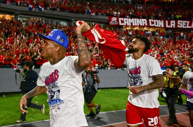 Panama's defender #15 Eric Davis (L) and midfielder #20 Anibal Godoy celebrate after winning the 2026 FIFA World Cup Concacaf qualifier football match between Panama and El Salvador at the Rommel Fernandez Stadium in Panama City on November 18, 2025. (Photo by MARTIN BERNETTI / AFP)