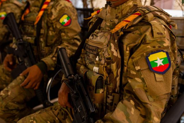 (FILES) Members of the Karen Border Guard Force (BGF) are pictured during a crackdown operation on illicit activity linked to scam centres in Shwe Kokko in Myanmar's eastern Myawaddy township on February 14, 2025. Myanmar's military said it raided the internet scam hub of Shwe Kokko on the Thai border, arresting nearly 350 people, part of a highly publicised crackdown against the booming black market compounds. (Photo by AFP)