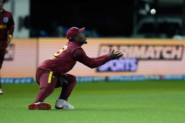 West Indies's Sherfane Rutherford catches New Zealand's Will Young during the second one-day international cricket match between New Zealand and the West Indies at McLean Park in Napier on November 19, 2025. (Photo by Marty MELVILLE / AFP)
