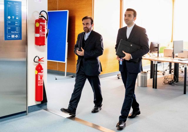 Iran’s ambassador to the International Atomic Energy Agency (IAEA) Reza Najafi (L) arrives to the IAEA’s Board of Governors meeting at the agency's headquarters in Vienna, Austria, on November 19, 2025. (Photo by Joe Klamar / AFP)