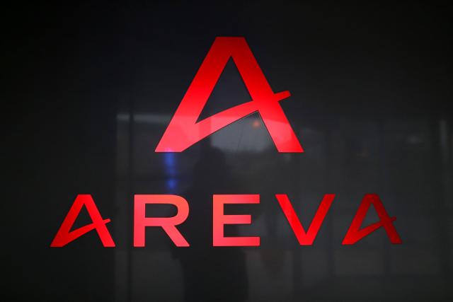 (FILES) This photograph shows the logo French multinational energy group Areva during a press visit to Areva's nuclear waste reprocessing plant in Beaumont-Hague, northwestern France on December 16, 2015. Fifteen years after a protracted hostage crisis, French nuclear giant Areva is facing criminal charges for allegedly underestimating the threat posed by Al-Qaeda, thereby facilitating the 2010 kidnapping of five French nationals, one Madagascan and one Togolese near the Arlit uranium mine in Niger. Confirming a report of French newspaper Le Parisien, sources close to the case told AFP on November 16, 2025, that a trial had been ordered for Areva for "unintentional injury through clumsiness, carelessness, inattention, negligence or failure to comply with a duty of care and safety imposed by law or regulation, resulting in total incapacity to work for more than three months". (Photo by CHARLY TRIBALLEAU / AFP)