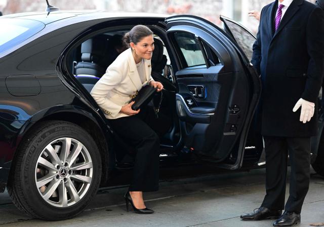 Crown Princess Victoria of Sweden gets out of her car before meeting the German Chancellor (unseen) upon her arrival in the courtyard of the Chancellery in Berlin on November 19, 2025. (Photo by John MACDOUGALL / AFP)