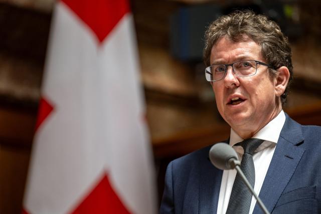 (FILES) Swiss Transport Minister Albert Rosti attends a session of the parliament in Bern on June 15, 2023. Swiss Transport Minister Albert Rosti will represent Switzerland in attendance of the COP30 in Belem. COP30 host Brazil released a draft pact on Tuesday, hoping to get nations to agree on the most contentious points as soon as Wednesday, two days before the conference is scheduled to end in the Amazonian city. (Photo by Fabrice COFFRINI / AFP)