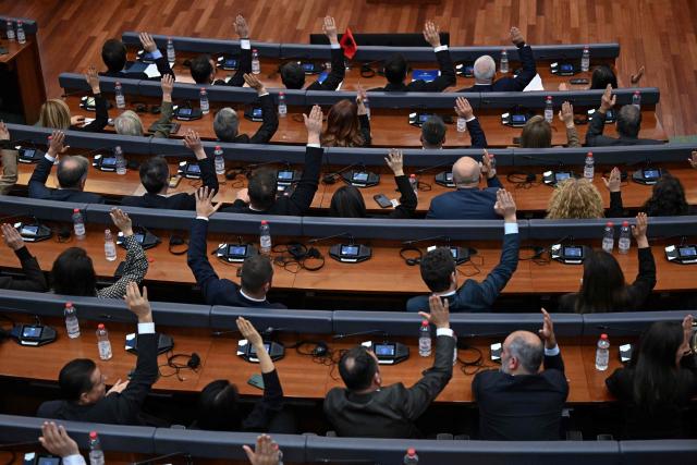 Kosovo's MPs vote during a parliament session to form the new government, in Pristina on November 19, 2025. After months of political wrangling, Kosovo's caretaker prime minister Albin Kurti failed to form a government on November 19, 2025 pushing the tiny Balkan nation toward its second election in under a year. With fresh elections expected to be announced, Kurti's party will hope to improve on its result from February's vote, when it fell short of a majority despite topping the poll. (Photo by Armend NIMANI / AFP)