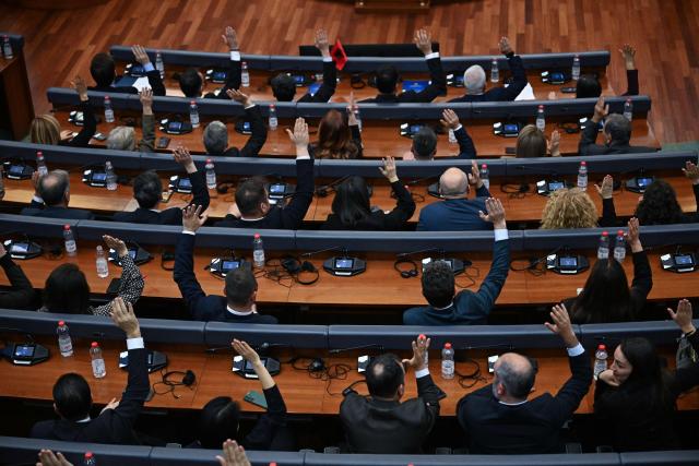 Kosovo's MPs vote during a parliament session to form the new government, in Pristina on November 19, 2025. After months of political wrangling, Kosovo's caretaker prime minister Albin Kurti failed to form a government on November 19, 2025 pushing the tiny Balkan nation toward its second election in under a year. With fresh elections expected to be announced, Kurti's party will hope to improve on its result from February's vote, when it fell short of a majority despite topping the poll. (Photo by Armend NIMANI / AFP)