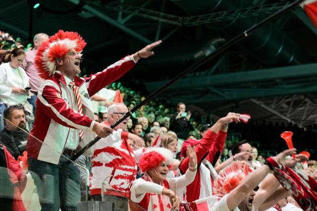 Austrian supporters cheer during the first Davis Cup men's singles quarter finals tennis match between Italy's Matteo Berretini and Austria's Jurij Rodionov, at the Super Tennis Arena, in Bologna, northen Italy, on November 19, 2025. (Photo by Tiziana FABI / AFP)