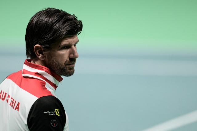Austria's coach Jurgen Melzer attends the first Davis Cup men's singles quarter finals tennis match between Italy's Matteo Berretini and Austria's Jurij Rodionov, at the Super Tennis Arena, in Bologna, northen Italy, on November 19, 2025. (Photo by Tiziana FABI / AFP)