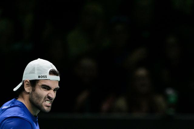 Italy's Matteo Berretini reacts against Austria's Jurij Rodionov during their Davis Cup men's singles quarter finals tennis match, at the Super Tennis Arena, in Bologna, northen Italy, on November 19, 2025. (Photo by Tiziana FABI / AFP)