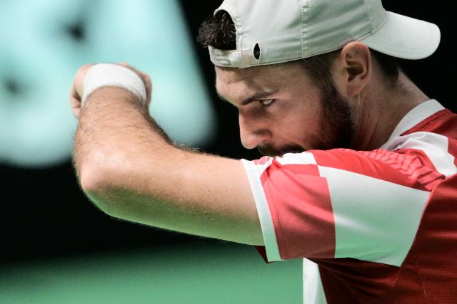 Austria's Jurij Rodionov gestures against Italy's Matteo Berretini during their Davis Cup men's singles quarter finals tennis match, at the Super Tennis Arena, in Bologna, northen Italy, on November 19, 2025. (Photo by Tiziana FABI / AFP)
